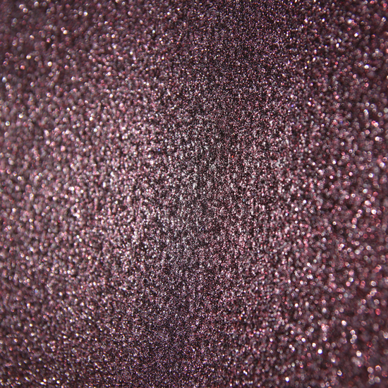 Close-up of Mystic decorative paint texture in Claret on a wall