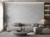 Contemporary living room with an accent wall finished in Moonlight in cool light grey with an all-over silver metallic texture. 