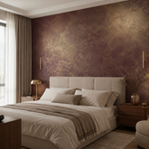 Luxury bedroom with an accent wall finished in Moonlight decorative paint in deep burgundy with golden metallic brushwork. 