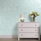 Silver Sand decorative paint in Turquise 2 shade with a wind-blown sand textured pearlescent finish on a wall