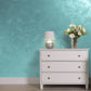 Silver Sand decorative paint in Turquise 40 shade with a wind-blown sand textured pearlescent finish on a wall