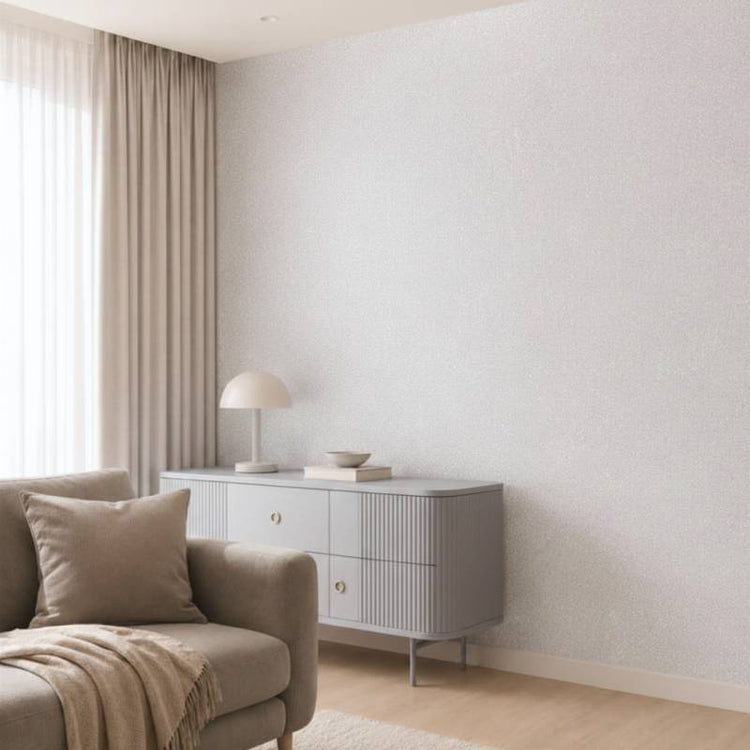 Warm beige glitter decorative paint accent wall in a sunlit modern living room